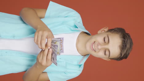 Vertical-video-of-The-boy-loves-money.